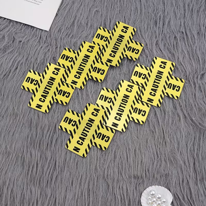 caution tape nipple covers